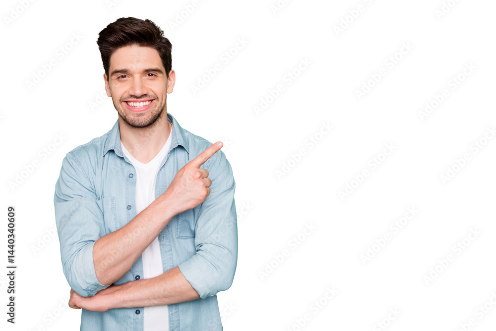 Photo of positive cheerful attractive handsome man pointing at empty space with forefinger smiling toothily with bristle isolated over green color vivid background Photo of positive cheerful attractive handsome man pointing at empty space with forefinger smiling toothily with bristle isolated over green color vivid background