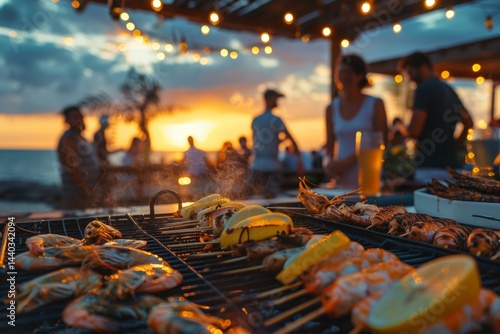 Fototapeta Naklejka Na Ścianę i Meble -  Sunset beach barbecue gathering with grilled seafood