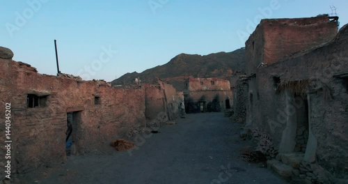 Abandoned village in the mountains of Yemen, perfect for illustrating postapocalyptic settings, lost civilizations, deserted landscapes in creative projects.