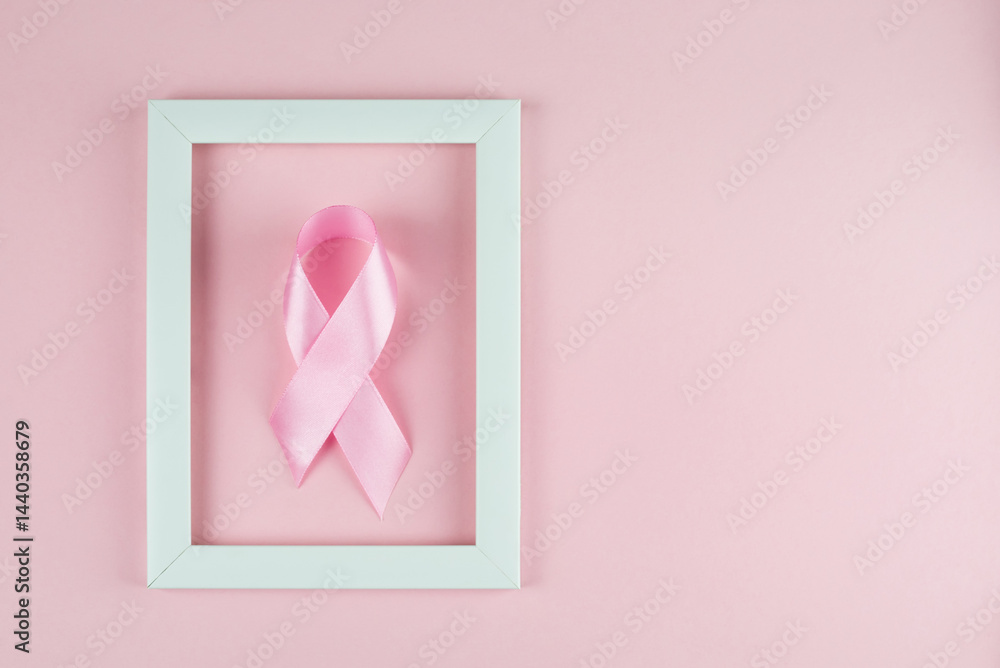 World Breast Cancer Day. Pink ribbon white frame on pink background,