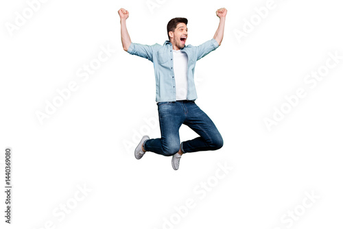 Obraz na płótnie Full body photo of handsome guy jumping high sportive competition participant celebrating first place champion wear casual denim clothes isolated green color background w salonie