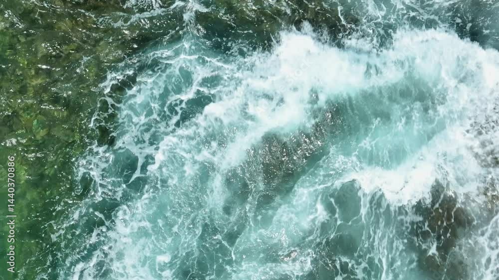 The waves in slow motion unfold in an impressive display of power, crashing against the rocky shore and sending white foam scattering in all directions. Thailand.
The waves in slow motion unfold in an impressive display of power, crashing against the rocky shore and sending white foam scattering in all directions. Thailand.