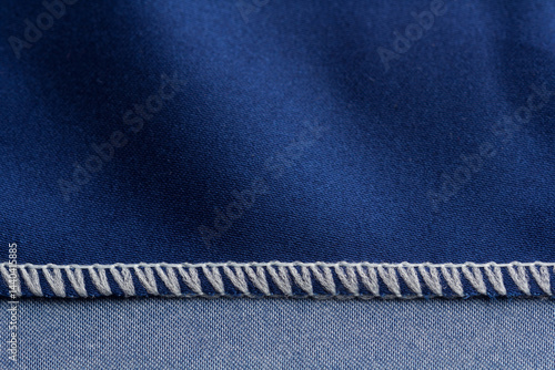 Obraz na płótnie Close up of overlock seam on a blue cloth w salonie