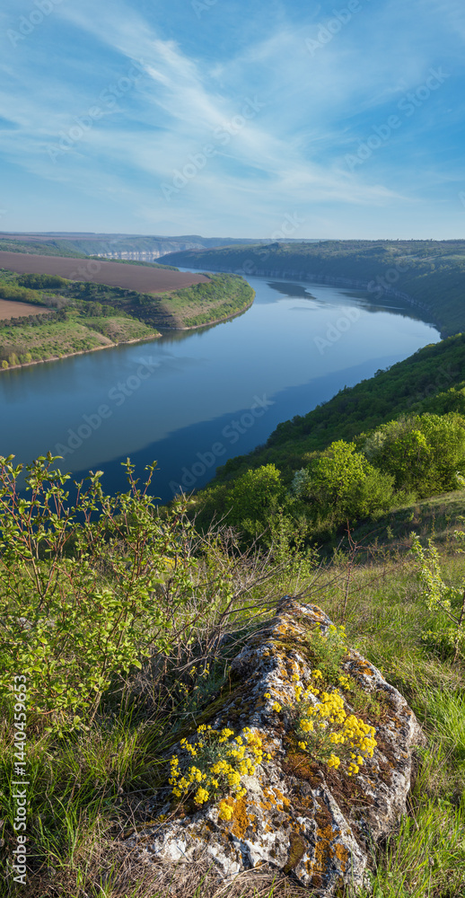 Amazing spring view on the Dnister River Canyon with picturesque rocks, fields, flowers. This place named Shyshkovi Gorby, Nahoriany, Chernivtsi region, Ukraine.