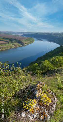 Obraz na płótnie Amazing spring view on the Dnister River Canyon with picturesque rocks, fields, flowers. This place named Shyshkovi Gorby, Nahoriany, Chernivtsi region, Ukraine. w salonie