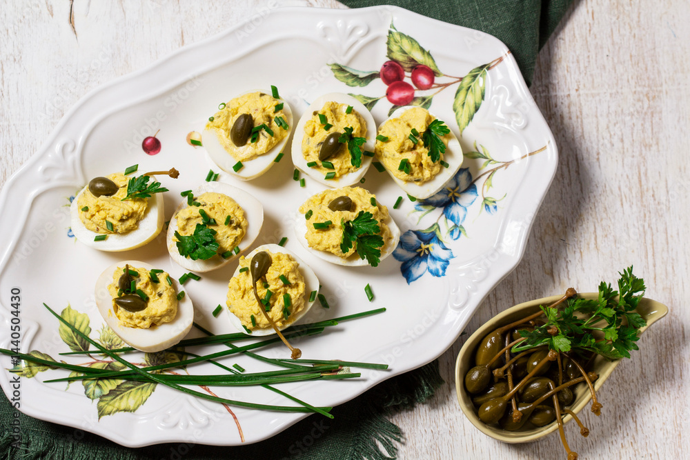 Eggs stuffed with mousse of egg yolk, mayonnaise, mustard and capers.