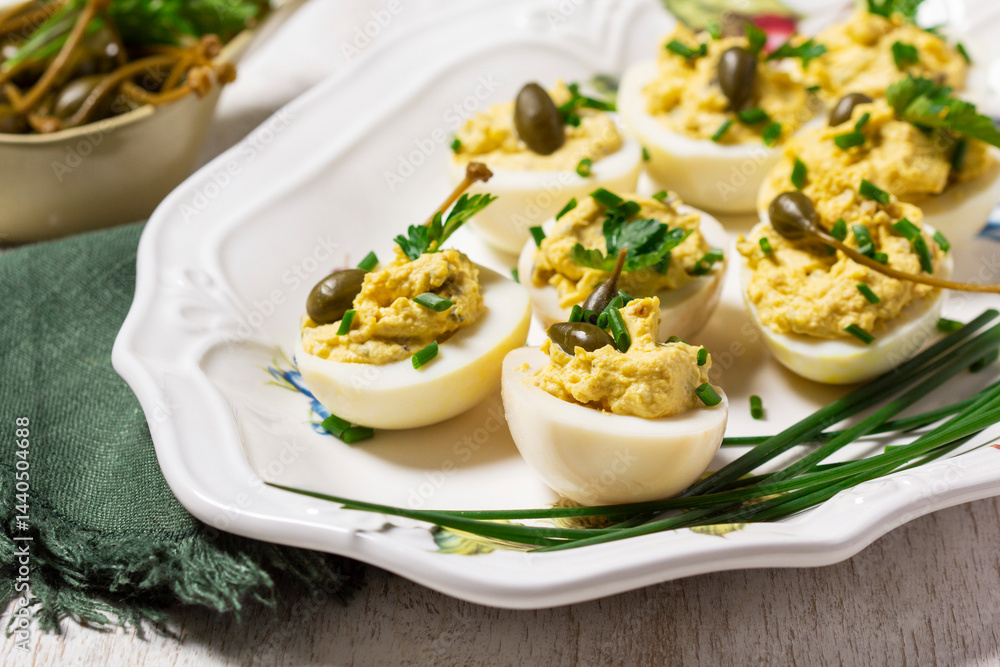 Eggs stuffed with mousse of egg yolk, mayonnaise, mustard and capers.