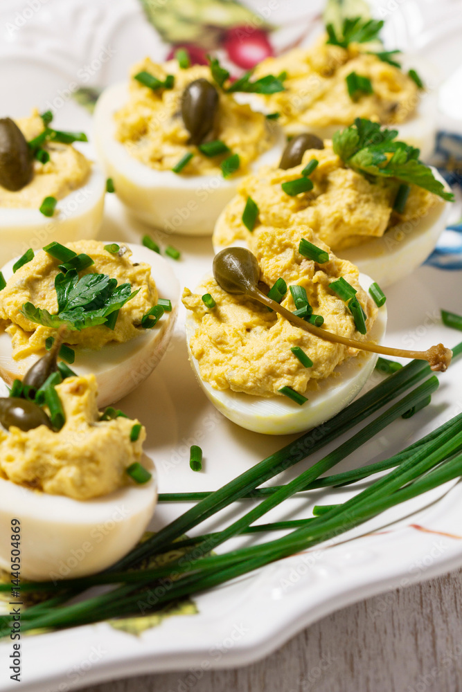 Eggs stuffed with mousse of egg yolk, mayonnaise, mustard and capers.