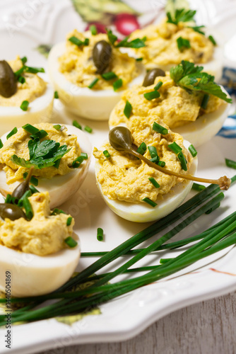 Obraz na płótnie Eggs stuffed with mousse of egg yolk, mayonnaise, mustard and capers. w salonie