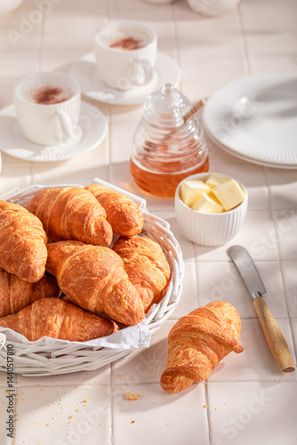 Obraz na płótnie Homemade and fresh french croissants with honey and butter. w salonie