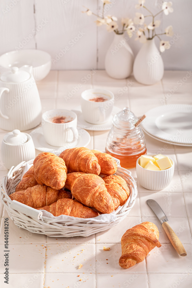 Crunchy and tasty french croissants with honey and butter.