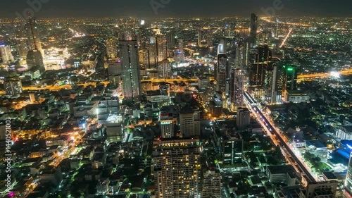 Wallpaper Mural 4K Time lapse elevated city views of building construction with traffic intersection and road in rush hour at night time in Bangkok, transportation with cityscape concept Torontodigital.ca