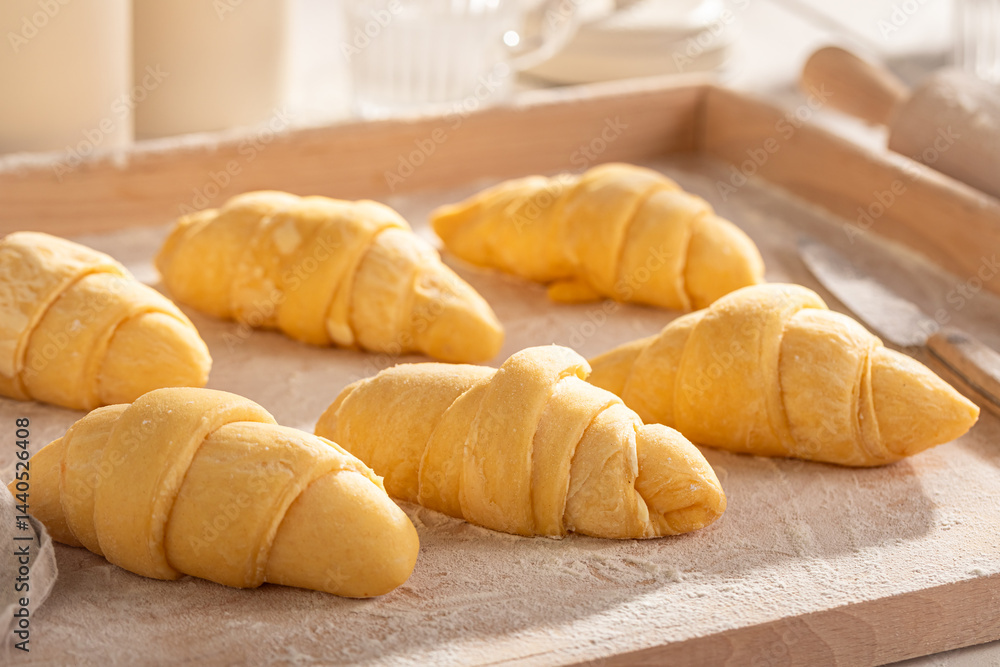 Delicious french croissants prepared on pastry board.