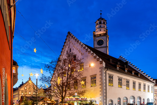 Obraz na płótnie Romantic Christmas market in Ravensburg with historic town hall illuminated under a deep blue evening sky w salonie