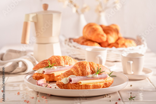 Obraz na płótnie Golden and fresh french croissant as a breakfast sandwich. w salonie
