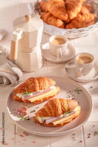 Golden and fresh french croissant served with coffee.