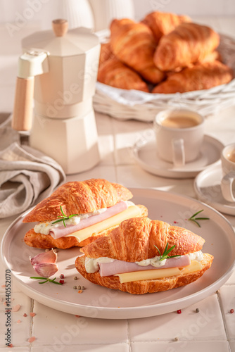Obraz na płótnie Homemade and hot french croissant with ham and cheese. w salonie