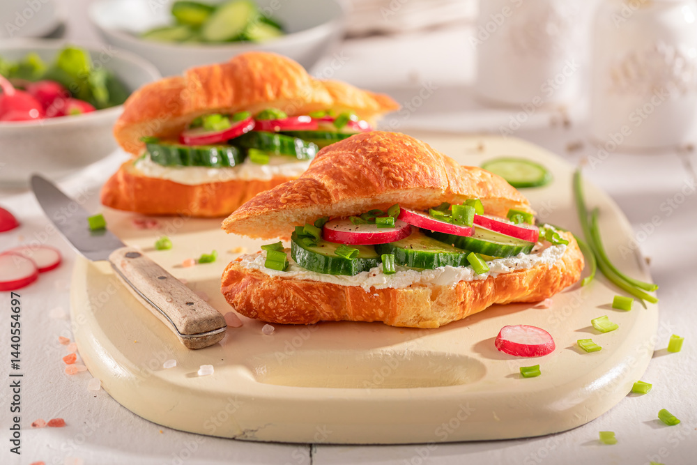 Tasty and hot french croissant as a sandwich for vegans.