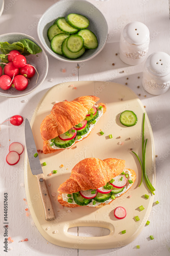 Tasty and hot french croissant with radish and cottage cheese.