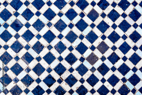 Traditional Moroccan blue and white zellige diamond tile pattern from Marrakesh, featuring geometric mosaic design, historic artisan craftsmanship, ornamental decoration or authentic cultural heritage