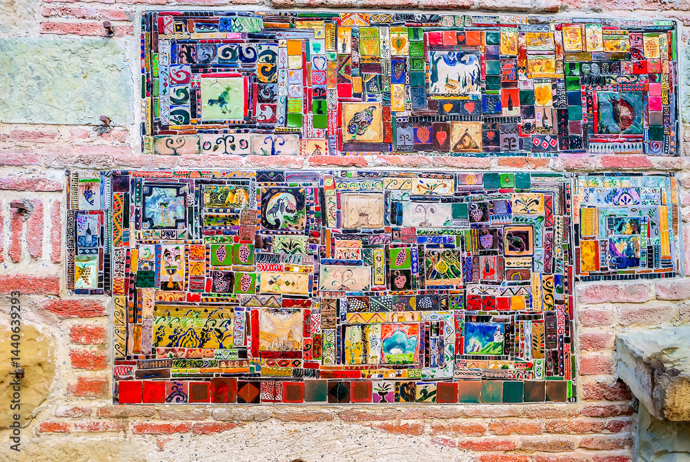 The closeup of mosaic tiles on the facade of Puppet Theatre, Tbilisi, Georgia.