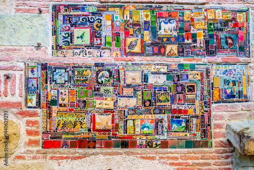 Obraz na płótnie The closeup of mosaic tiles on the facade of Puppet Theatre, Tbilisi, Georgia. w salonie
