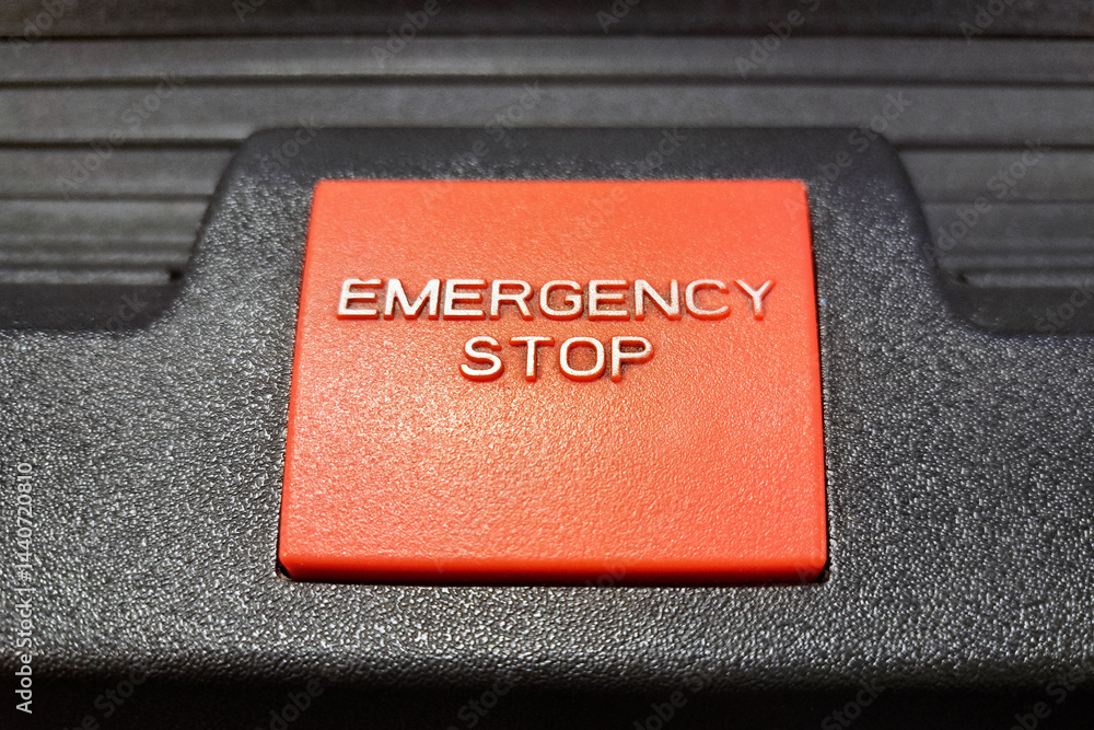 Red emergency stop button. Safety control device. Industrial machine switch. Stop operation button. Red switch closeup. Security shutdown system. Danger prevention concept. Safety protection.