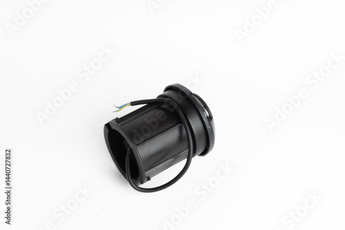 Black Round Inground Outdoor LED Light with Side Openings and Exposed Wires Isolated on White Background

