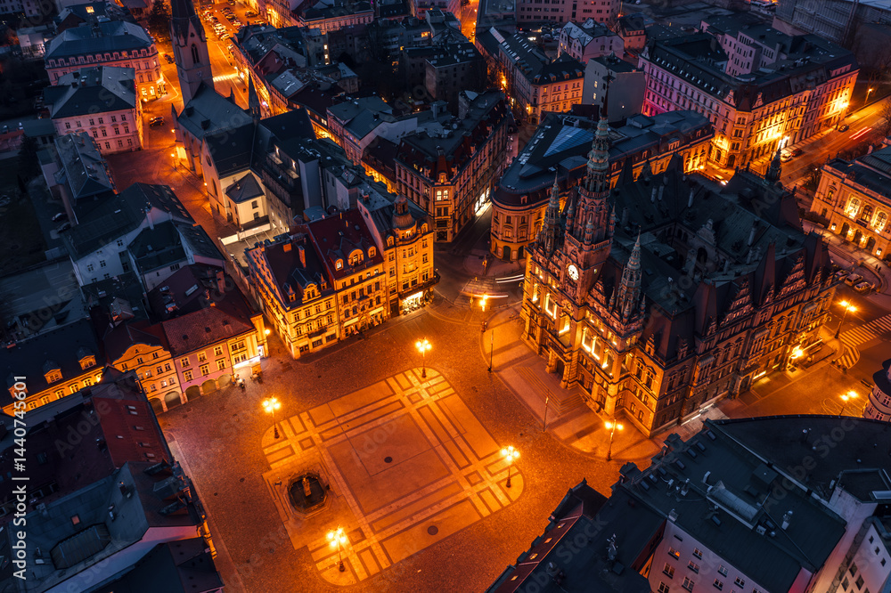 Evening skyline cityscape of Liberec, Czech Republic. Panoramic aerial view of the old town (staré město): main square and city hall at night