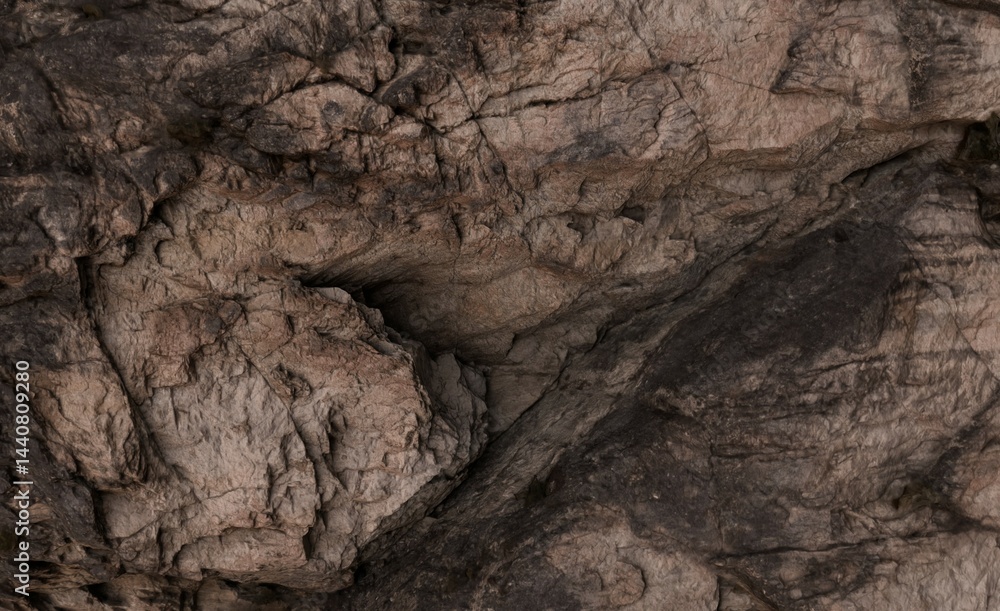 Fototapeta premium Close-up view of rough, textured rock face