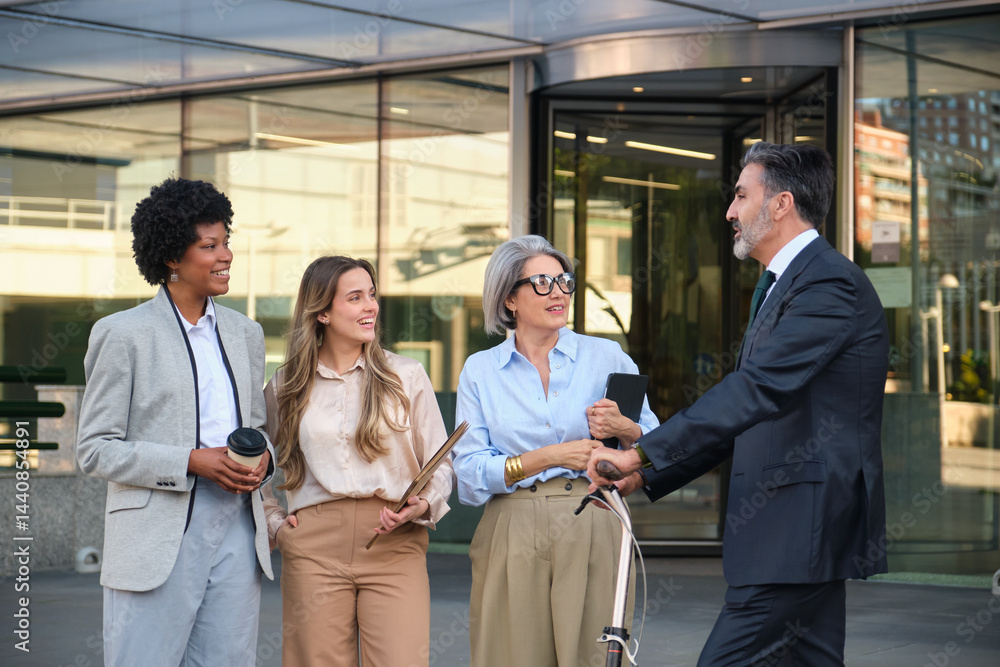 Business colleagues talking about a new project in front of their office building