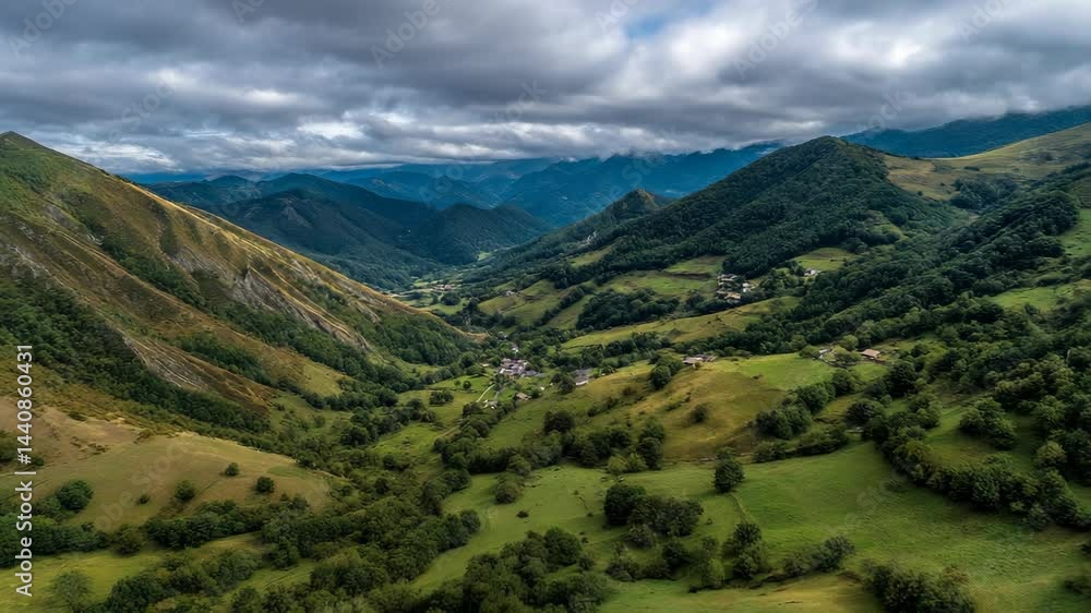 Breathtaking view of lush green valleys and majestic mountains in the early afternoon with dramatic clouds Breathtaking view of lush green valleys and majestic mountains in the early afternoon with dramatic clouds