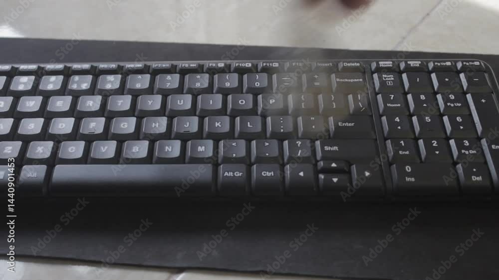 A plain black wireless keyboard taped over a mousepad.
April 28 2025
Pinrang, South Sulawesi Indonesia. A plain black wireless keyboard taped over a mousepad.
April 28 2025
Pinrang, South Sulawesi Indonesia.