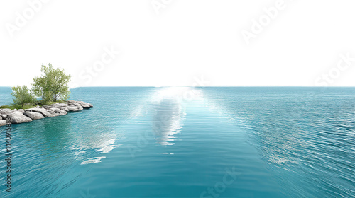A serene blue sea meets a rocky coastline on a bright and sunny day.