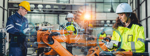 Foto Engineers operating advanced robotic arms in a high-tech industrial factory, fut