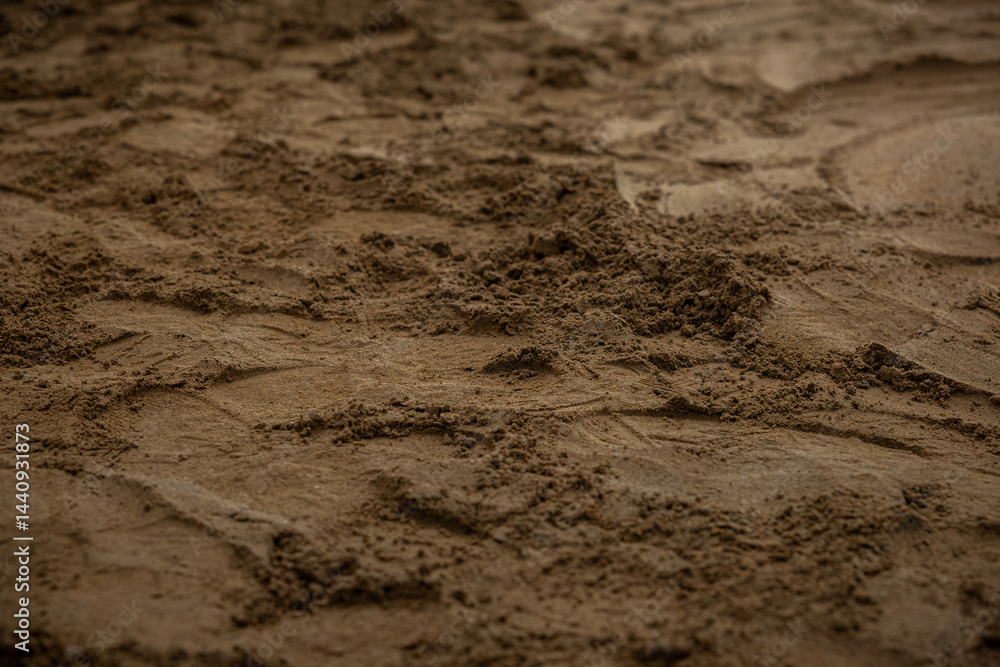 Close up view of a rough, textured Estrich concrete surface, showing uneven distribution and smoothing during the construction process.