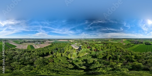 Foto Aerial 360° panorama of Schloss Dyck near Grevenbroich, Germany: historic castle, blooming gardens, orchards, and lush countryside in full spring bloom under a vibrant blue sky