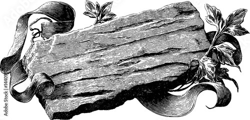 Engraved illustration of stone tablet with chisel and leaf motifs for vintage design