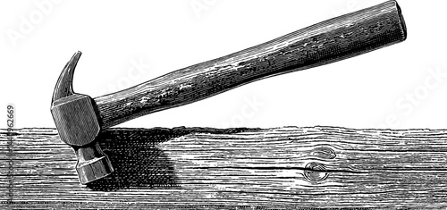 Vintage engraved illustration of hammer and nails on wooden surface for artisan design and print