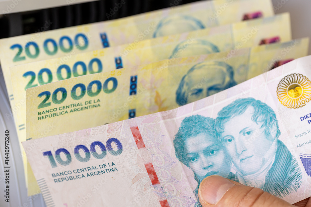 Argentine peso in a money counter. Financial and business concept. 10,000 and 20,000 banknotes, banking, economy, investments in Argentina