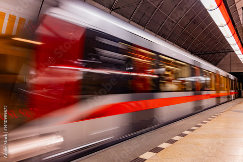 A moving subway train in a station