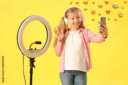 Teenage blogger in headphon...
