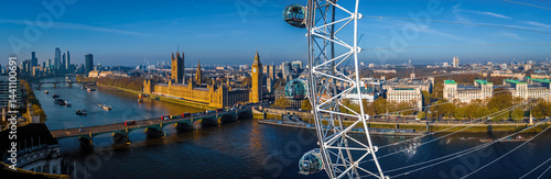 Iconic London skyline with London Eye in morning light over the Thames