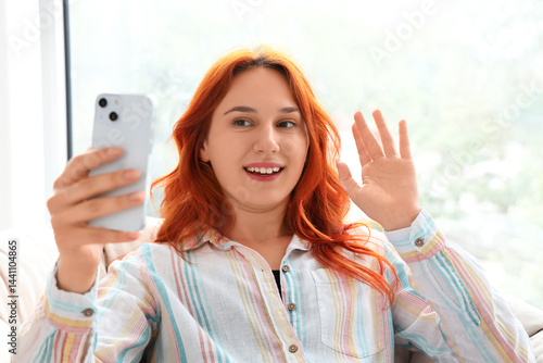 Young woman using mobile ph...