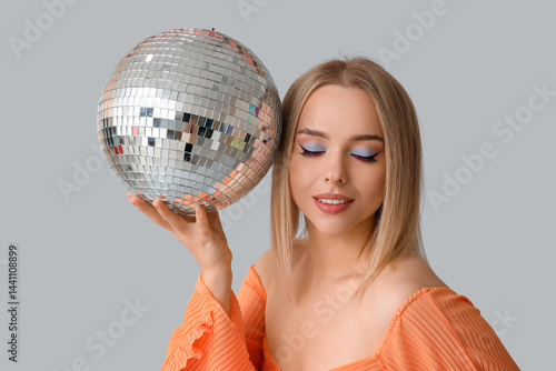 Blonde woman with closed ey...