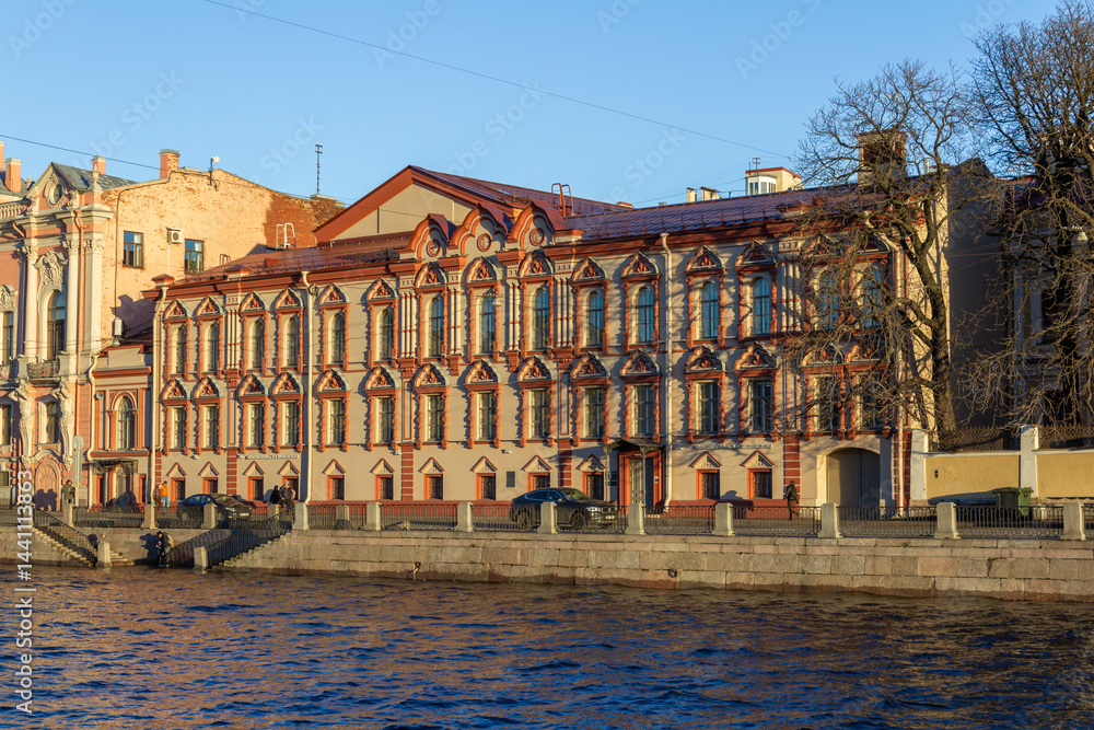 Fototapeta premium Central City Public Library named after V.V. Mayakovsky on Fontanka River embankment in Saint Petersburg, Russia. Historic architecture and urban cityscape