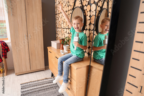 Cute little boy with microp...