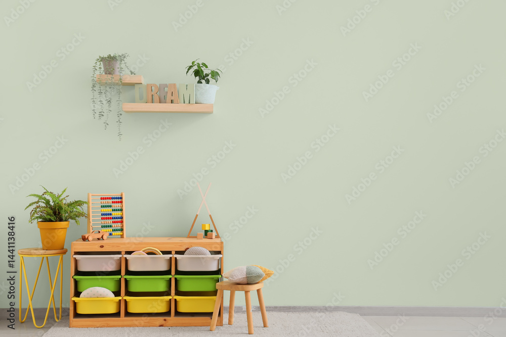Interior of children's room with shelves, plants and toys