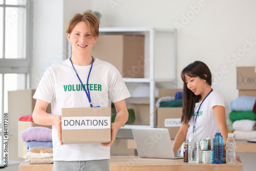 Young male volunteer with d...