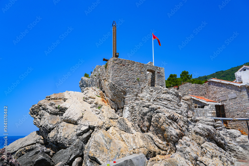 Kastio Castle built on a peninsula in Petrovac na Moru, a resort town located on the coast of the Adriatic Sea in Montenegro